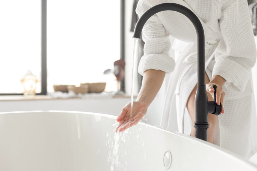 Testing bathtub water temperature